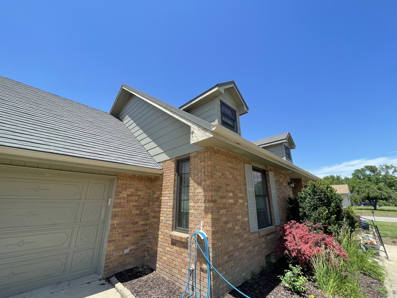 Before: weathered dormer siding and trim